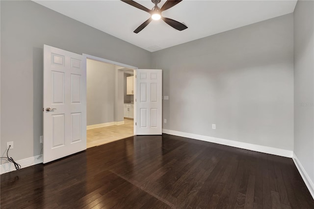 empty room with hardwood / wood-style flooring and ceiling fan