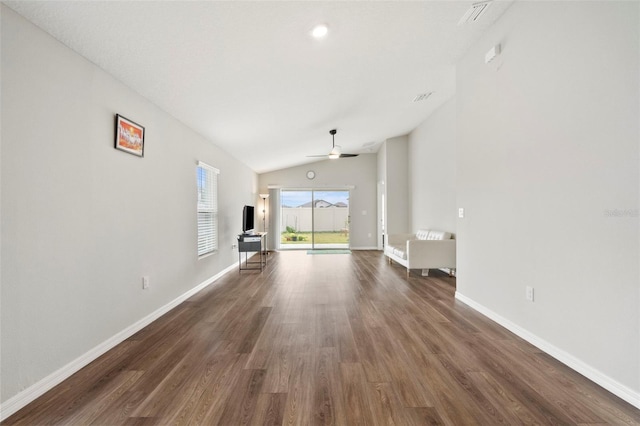 unfurnished living room with ceiling fan, dark wood-type flooring, and lofted ceiling