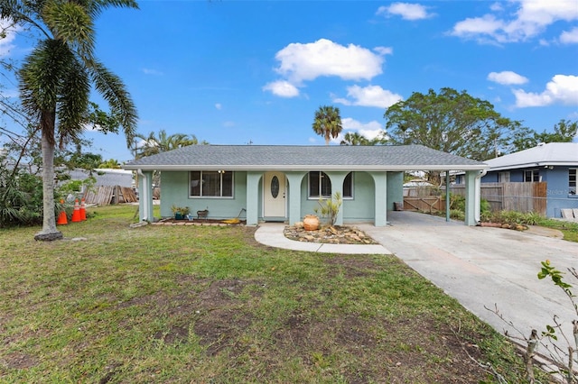 ranch-style house with a carport and a front lawn