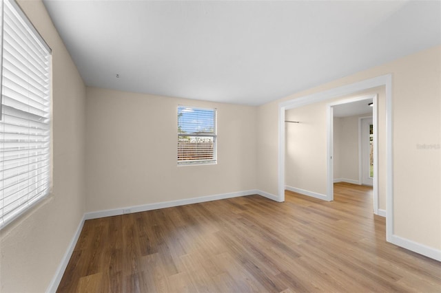 spare room with light hardwood / wood-style flooring