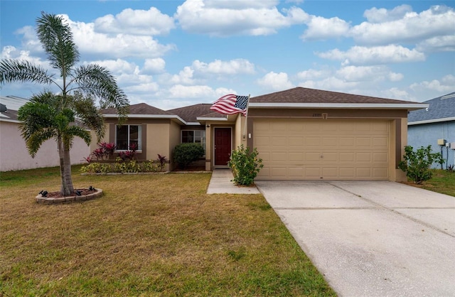 single story home featuring a garage and a front yard