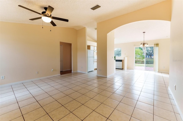 unfurnished room with light tile patterned floors, ceiling fan with notable chandelier, a textured ceiling, and vaulted ceiling