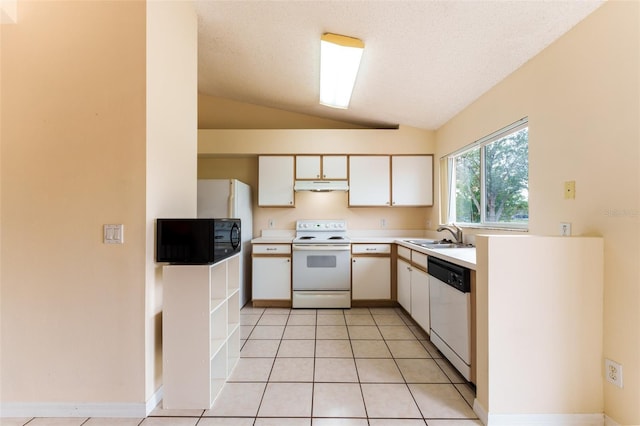 kitchen featuring vaulted ceiling, light tile patterned floors, white cabinets, and white appliances