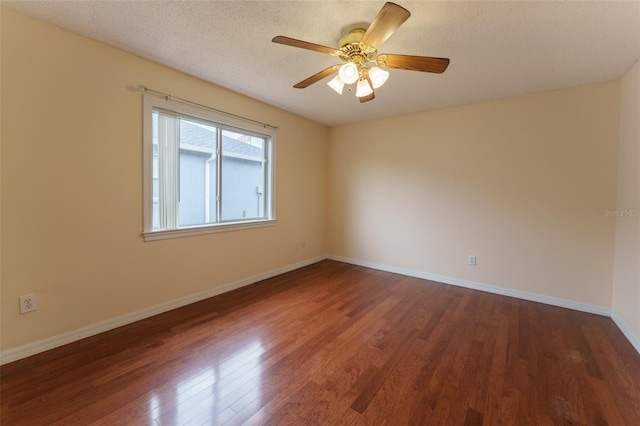 unfurnished room with hardwood / wood-style flooring, ceiling fan, and a textured ceiling