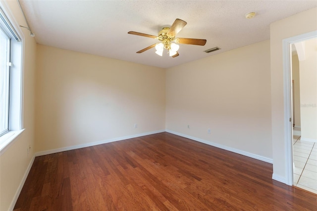 unfurnished room featuring ceiling fan and hardwood / wood-style floors