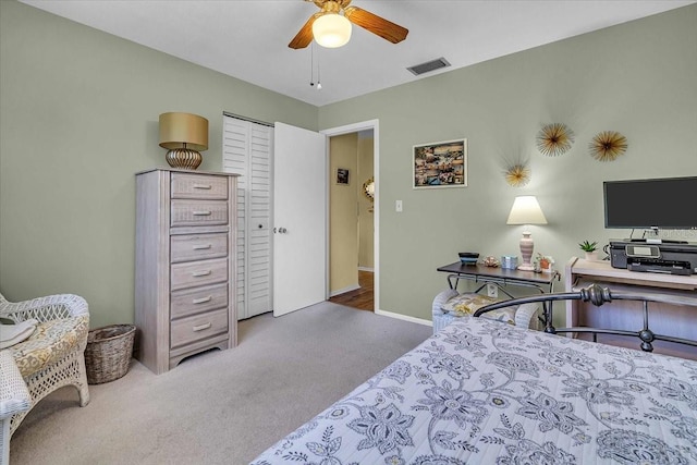 bedroom with carpet flooring, ceiling fan, and a closet