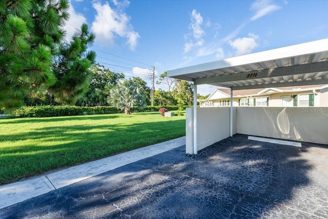 exterior space with a carport