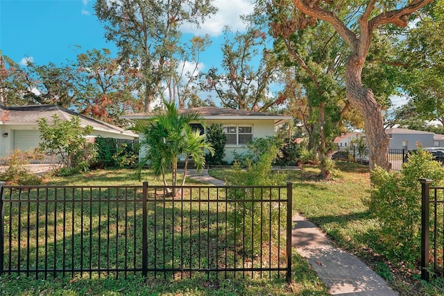 single story home with a front yard