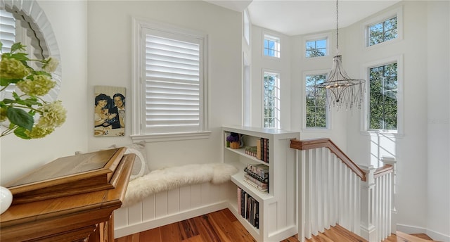 sitting room with an inviting chandelier and wood-type flooring