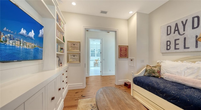 bedroom featuring light hardwood / wood-style floors