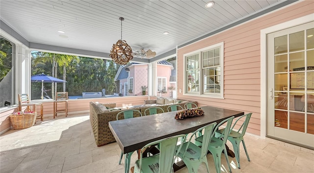 sunroom featuring plenty of natural light and wooden ceiling