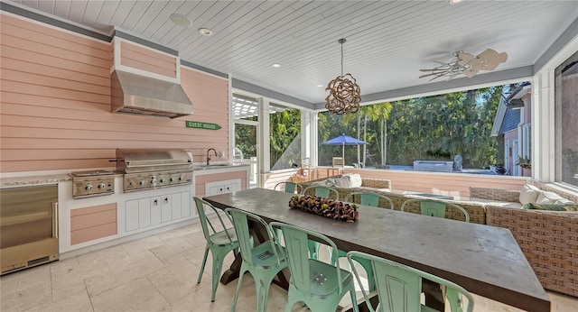 view of patio with ceiling fan, grilling area, area for grilling, and an outdoor wet bar