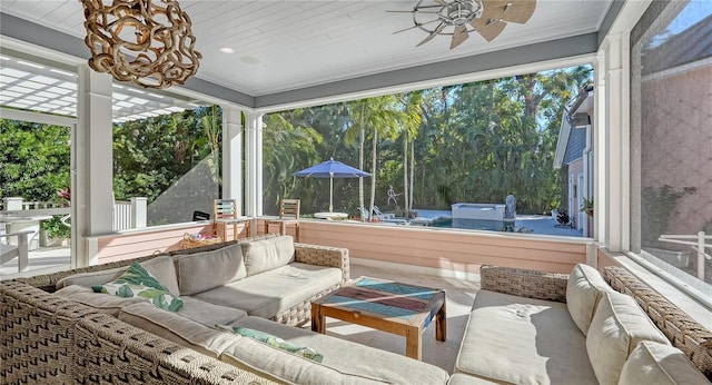 sunroom featuring a wealth of natural light, wooden ceiling, and ceiling fan