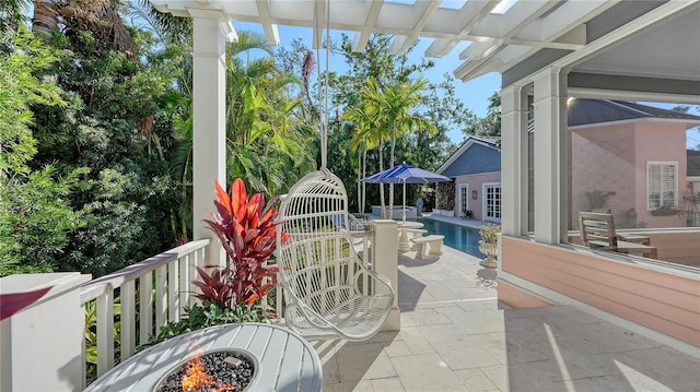 view of patio featuring an outdoor fire pit