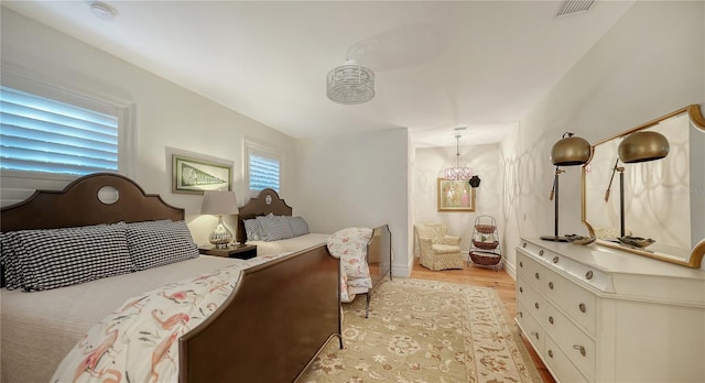 bedroom with light wood-type flooring