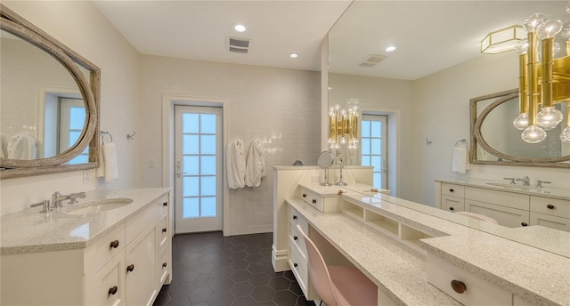 bathroom with vanity, tile walls, and tile patterned floors