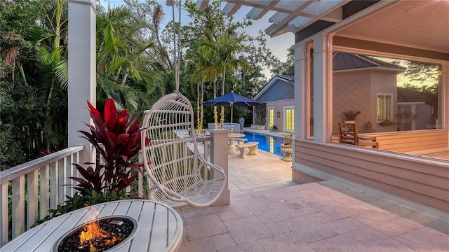 view of patio / terrace featuring a fire pit