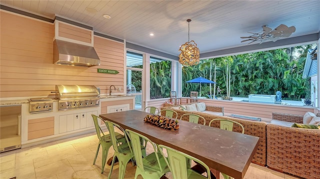 exterior space featuring sink, wood ceiling, and ceiling fan