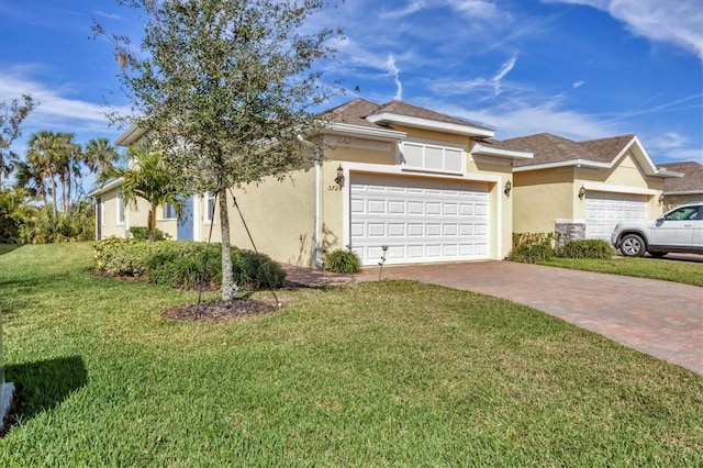 view of front facade featuring a front lawn and a garage