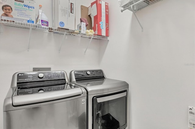 laundry area with washer and clothes dryer