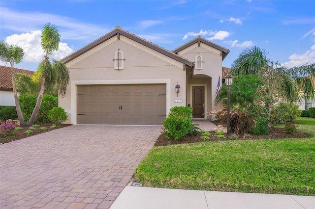 view of front facade featuring a front lawn and a garage