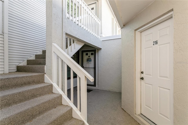 staircase with carpet flooring