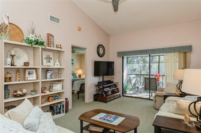 carpeted living room featuring vaulted ceiling and ceiling fan