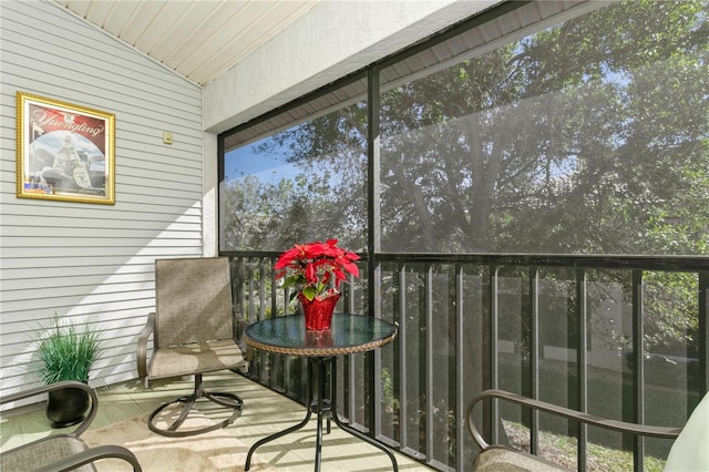 sunroom / solarium with vaulted ceiling