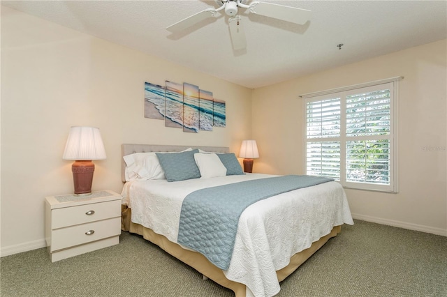 bedroom featuring ceiling fan and light colored carpet