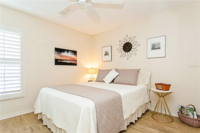 bedroom featuring hardwood / wood-style flooring and ceiling fan