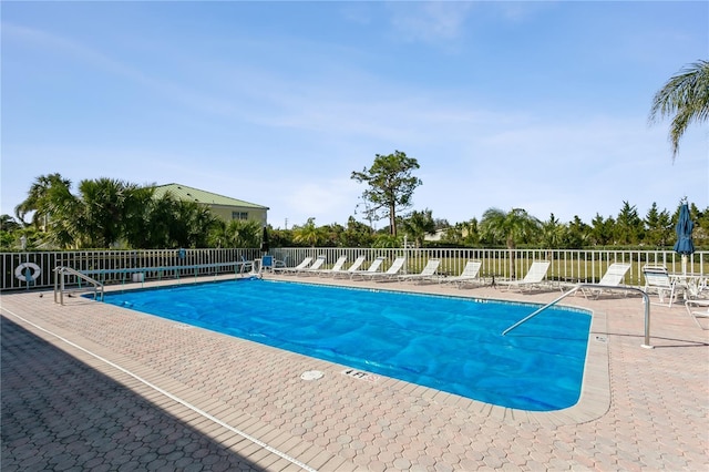 view of swimming pool featuring a patio area