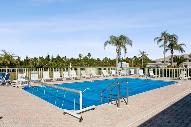 view of swimming pool with a patio