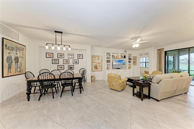 interior space featuring ceiling fan and crown molding