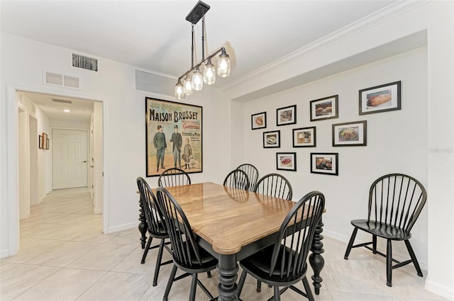 tiled dining room with ornamental molding