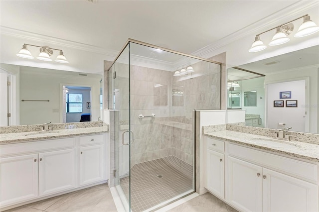 bathroom with crown molding, tile patterned flooring, vanity, and an enclosed shower