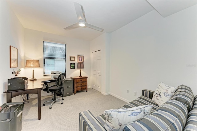 office area featuring light colored carpet and ceiling fan