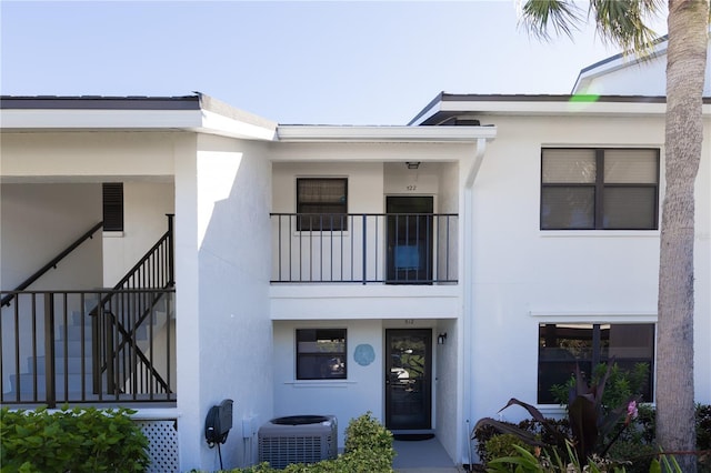 view of front of house with central air condition unit