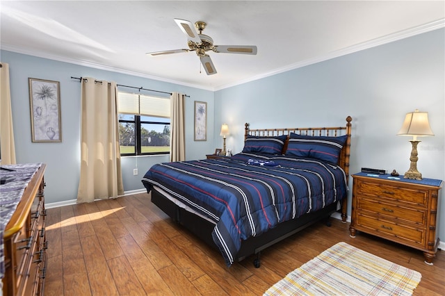 bedroom with dark hardwood / wood-style floors, ceiling fan, and ornamental molding