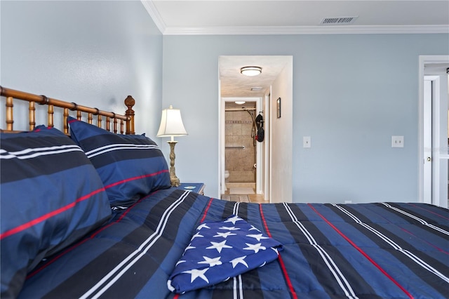 bedroom with ornamental molding and connected bathroom