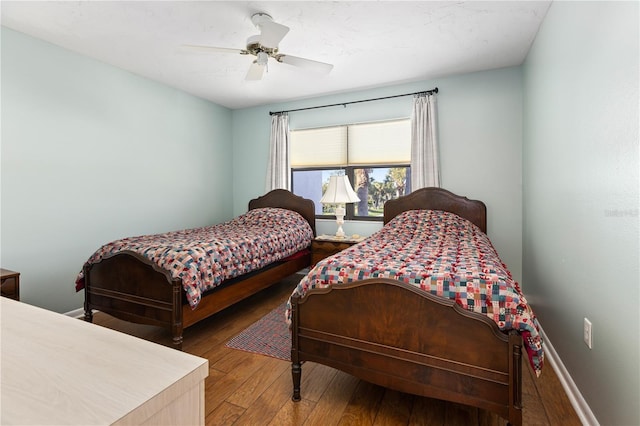 bedroom featuring hardwood / wood-style floors and ceiling fan