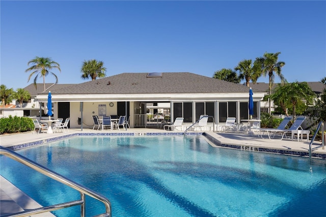 view of swimming pool with a patio