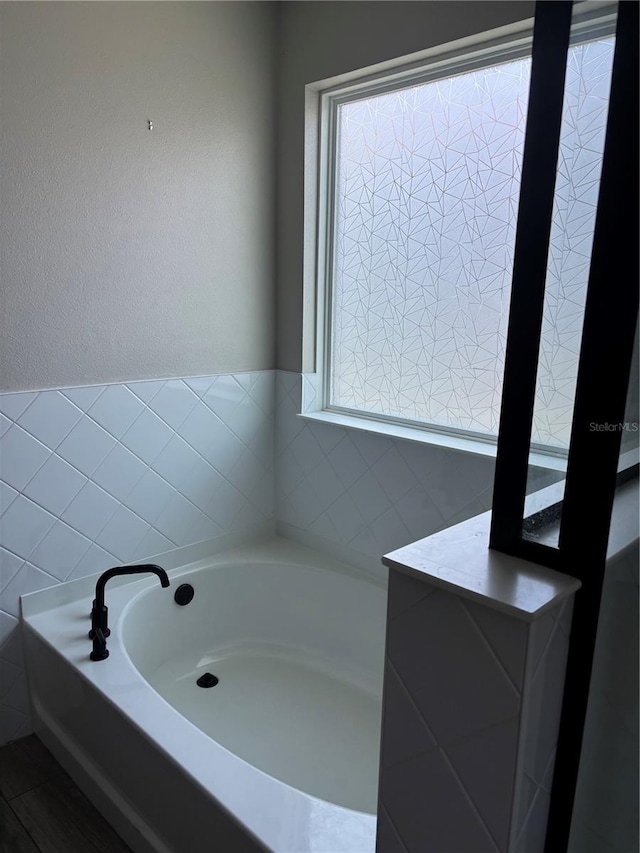 bathroom with a washtub