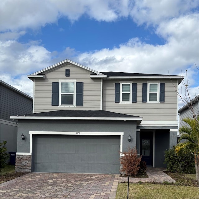 front of property with a garage