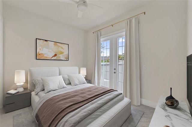 carpeted bedroom with access to exterior, ceiling fan, and french doors