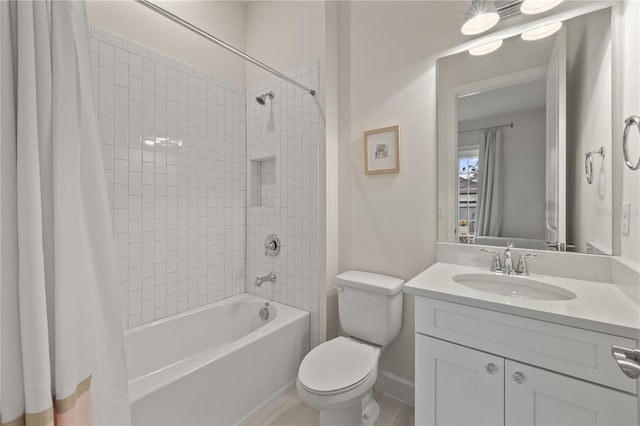 full bathroom featuring vanity, toilet, and shower / bath combo with shower curtain