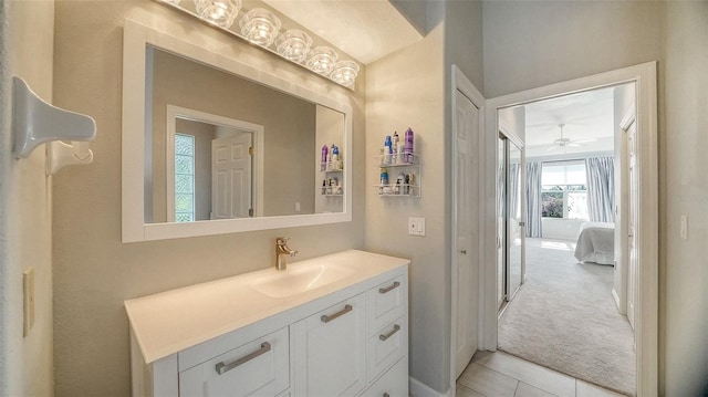 bathroom with tile patterned floors, ceiling fan, and vanity