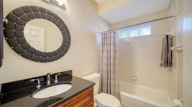 full bathroom with shower / bath combination with curtain, vanity, and toilet