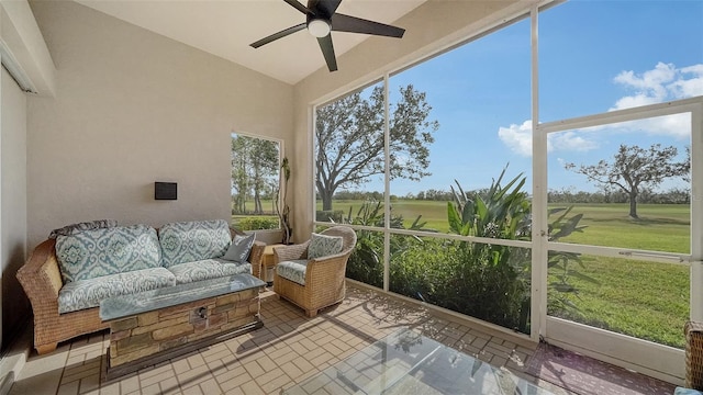 sunroom featuring ceiling fan