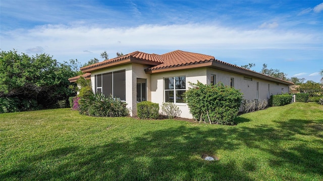 view of home's exterior with a lawn