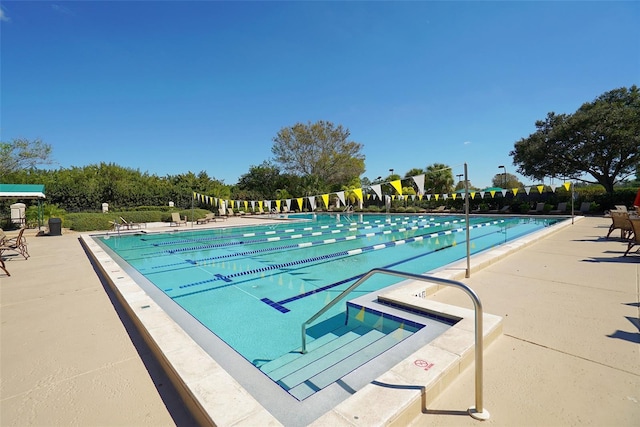 view of swimming pool with a patio area